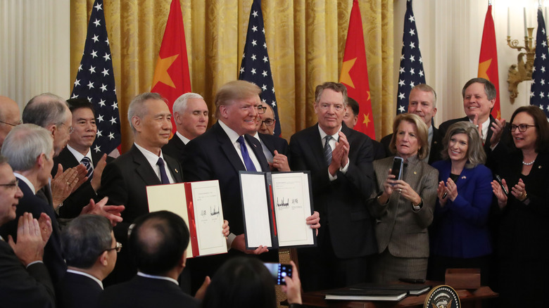 President Donald Trump and Chinese Vice Premier Liu He hold up signed Trade Deal, January 15th, 2020