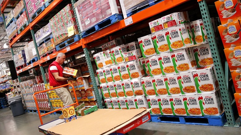 Costco worker stocking cereals