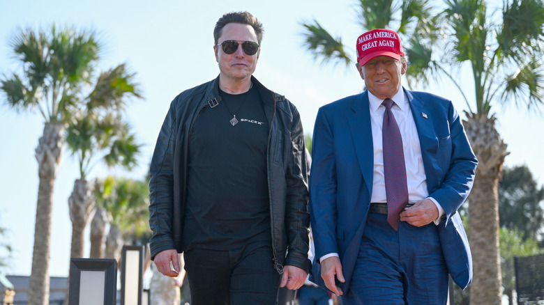 Elon Musk walking with Donald Trump