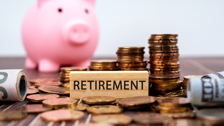 Piggy bank and stacks of coins representing retirement savings