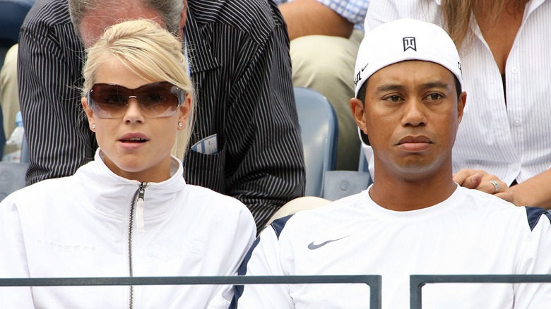 Tiger Woods and Elin Nordegren sitting