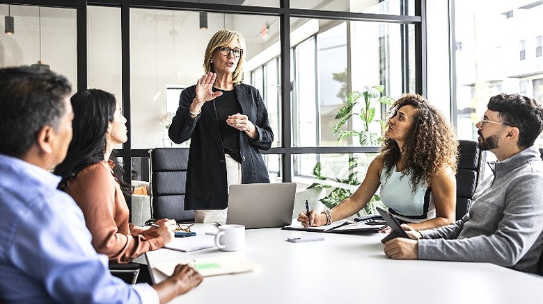 Boss leads worker meeting