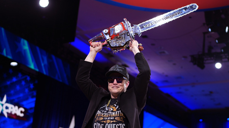 Elon Musk wields a chainsaw at CPAC.