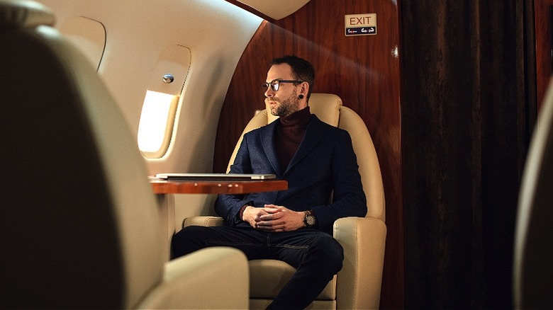 Wealthy man on private plane