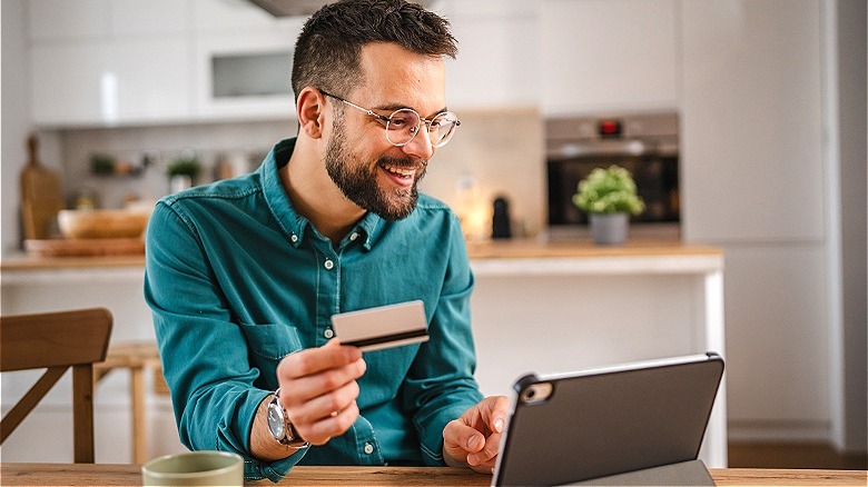 Person smiling while online shopping