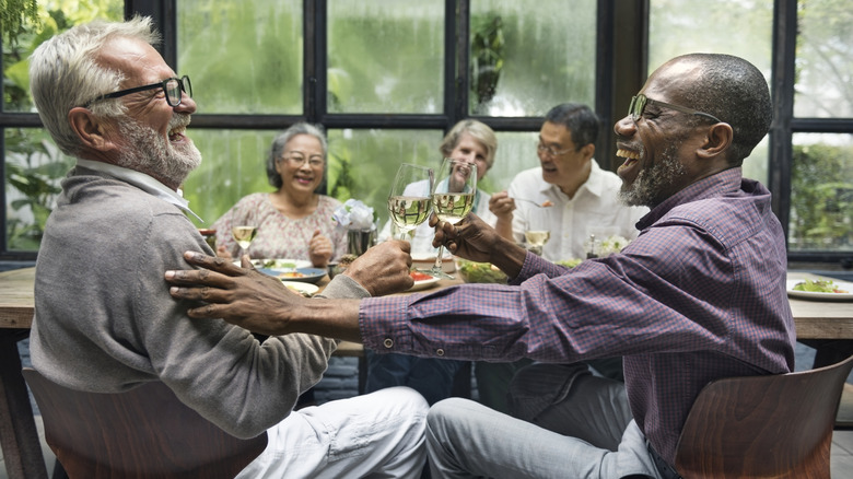 mature friends at a dinner party