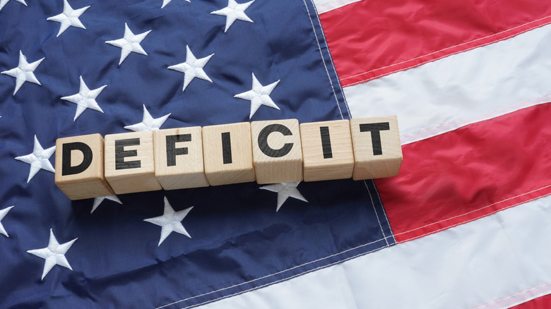 Woodblocks spelling out deficit on U.S. flag