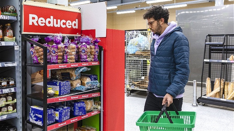 Person looking at reduced groceries