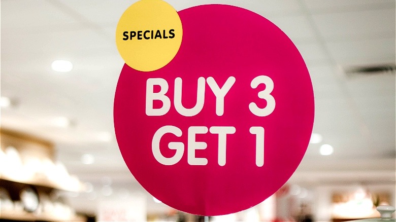 "Buy 3 Get 1" sign at store