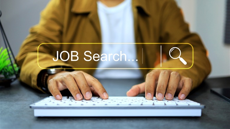 Person typing JOB search