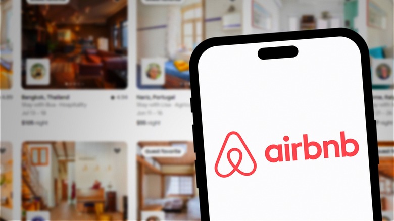 Airbnb logo on smartphone