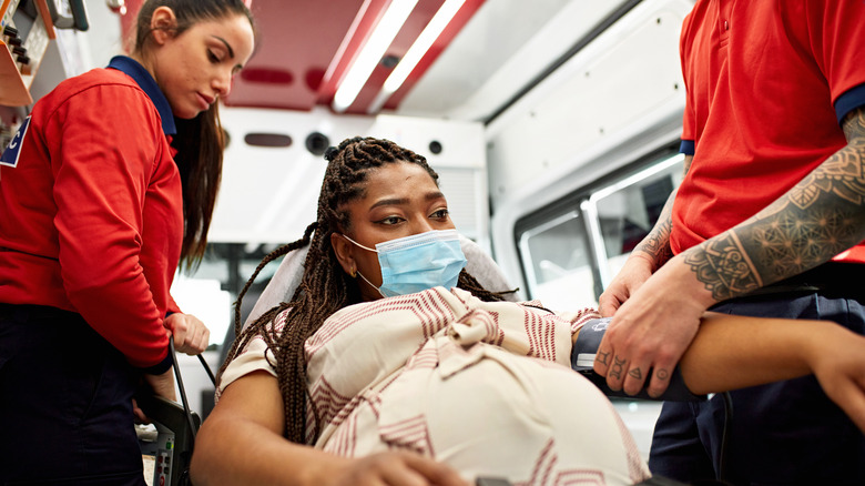A pregnant woman in an ambulance