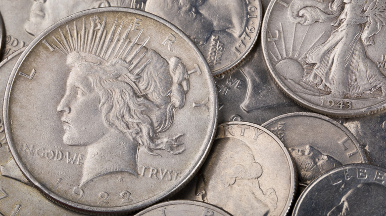 Different types of U.S. silver coins background.