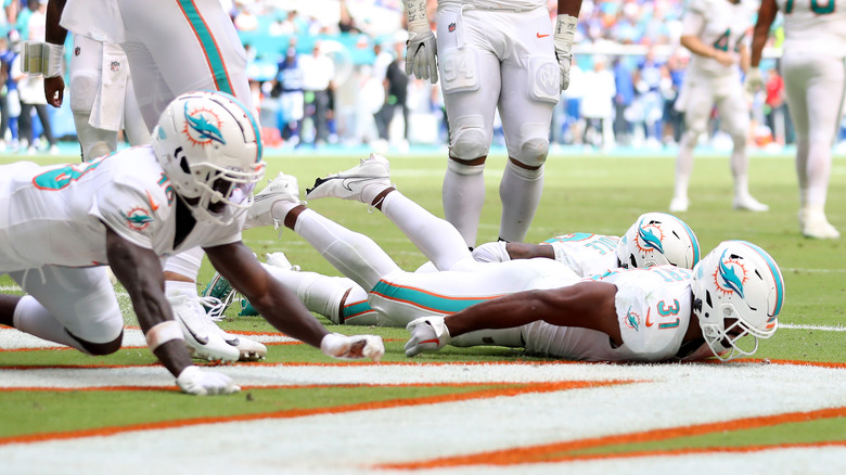 Miami Dolphins players celebrating a touchdown