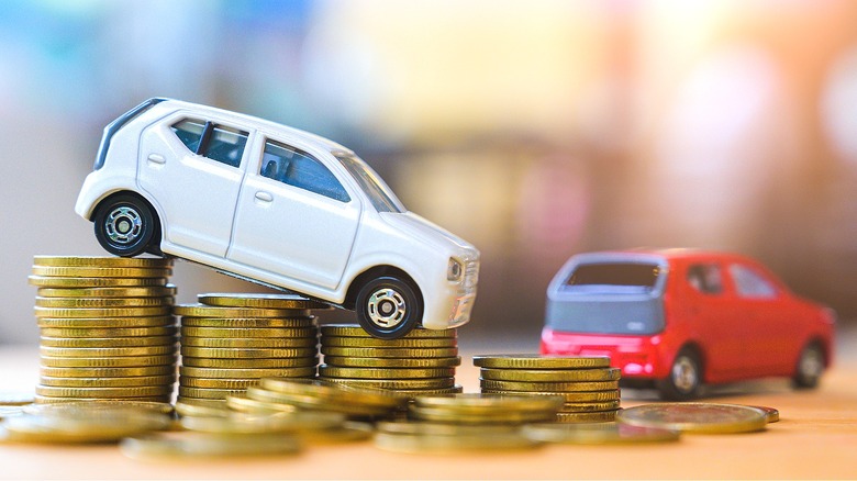 Model car descending coin stack