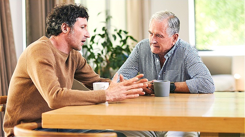 Son having conversation with father