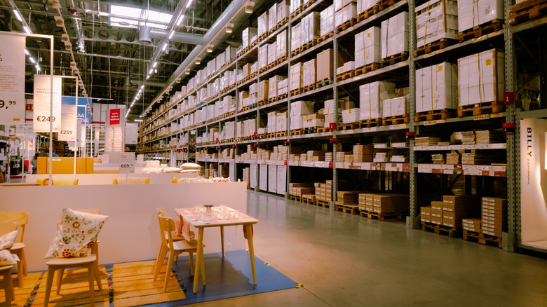 A massive IKEA warehouse area, lit by suny skylights.