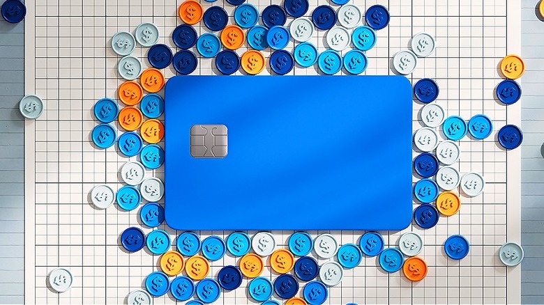 Coin buttons surrounding credit card