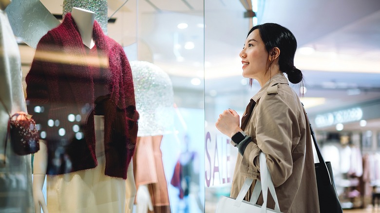 Person smiling at retail window