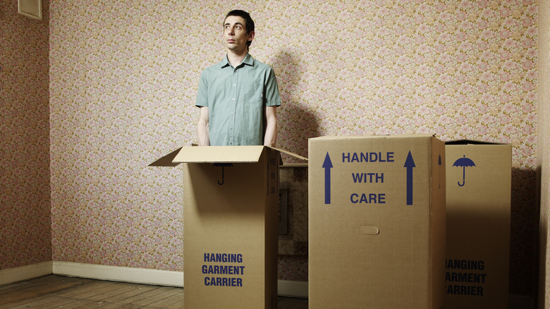 man standing in a box