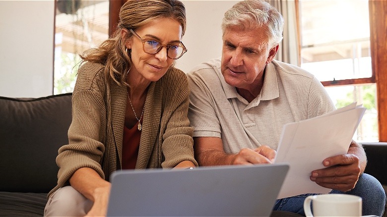 Retired couple calculating finances