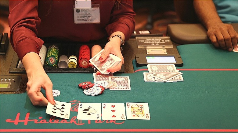 Dealer at blackjack table