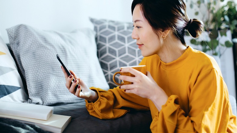 Person using phone at home