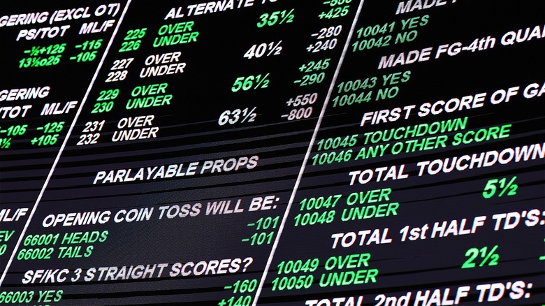 Bettors observe betting odds display