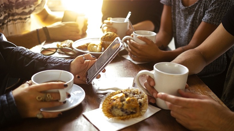 Group of friends having coffee