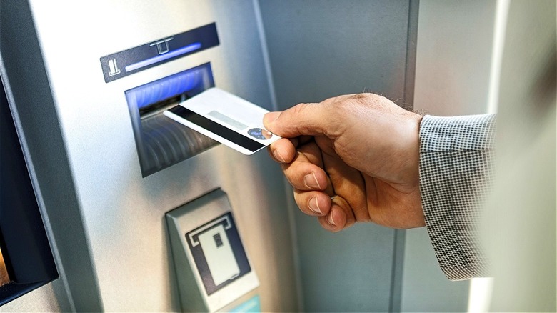 Person inserting ATM card