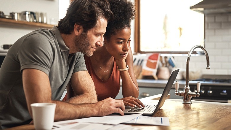 Couple reviewing monthly bills