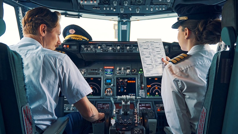 Copilots in cockpit before flight