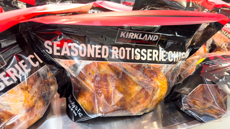 A prominent bag of Costco Kirkland Signature Rotisserie Chicken.