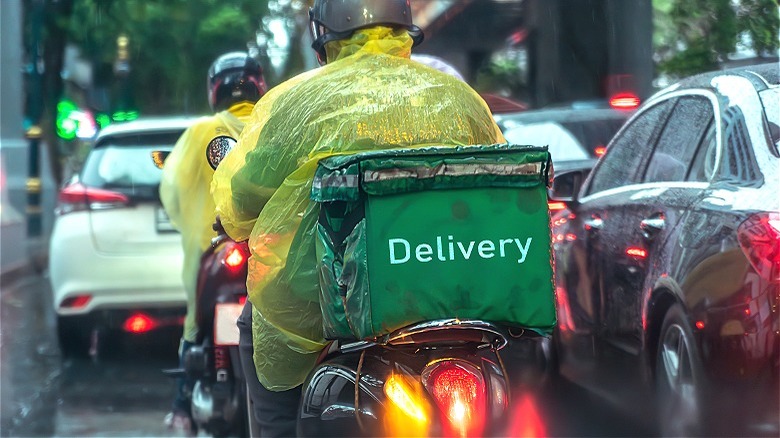 Delivery driver working in rain