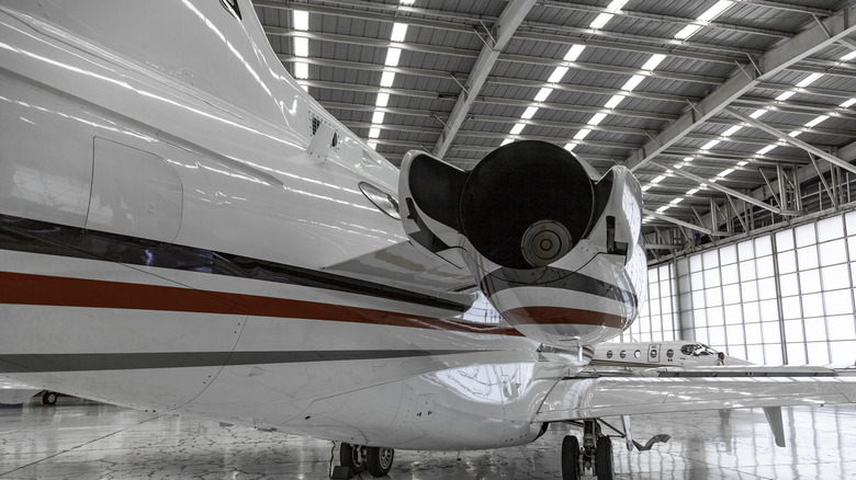 a charter jet in a hangar