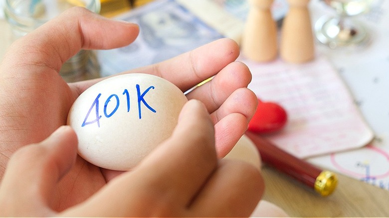 Hands holding egg with '401k' written on it