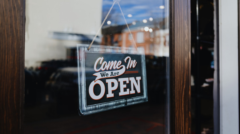 Come in we are open sign in shop window