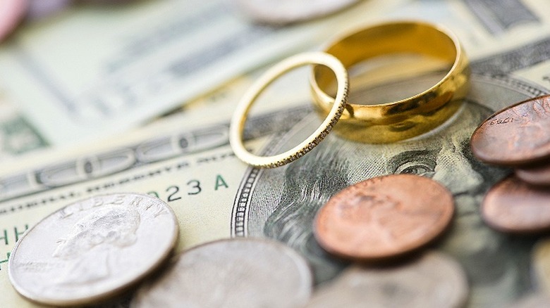 Wedding rings on paper money