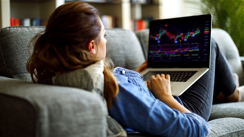 Person trading stocks at home