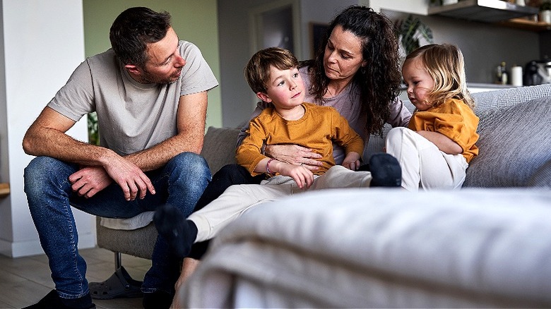 Parents talking to young children