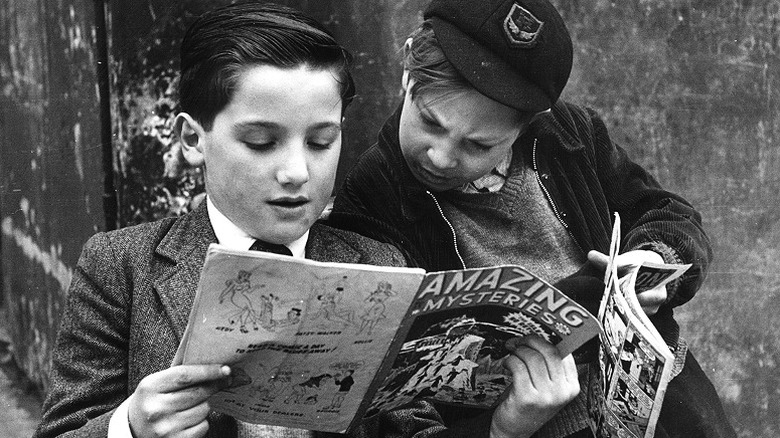 Young kids read comic books in a vintage photo