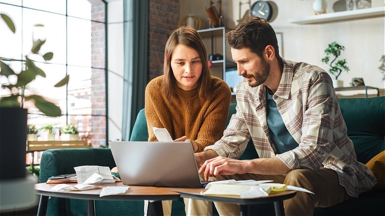 Couple reviewing financial documents together