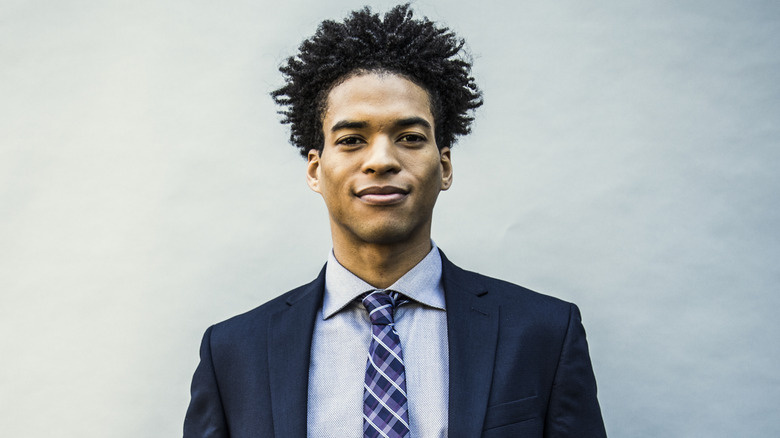 Man wearing a suit smiling