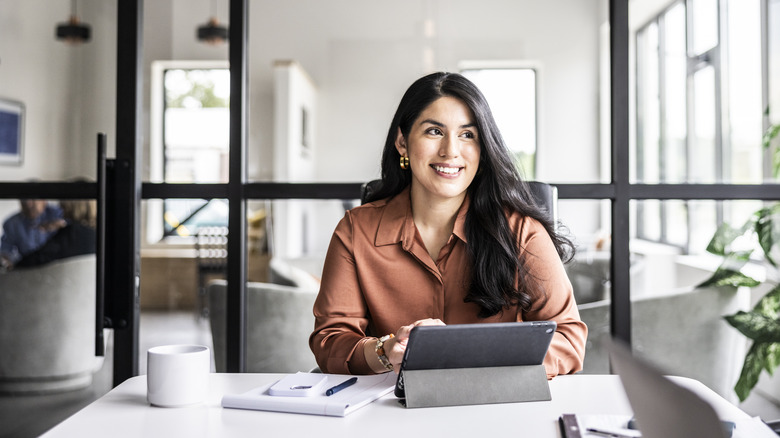 Young professional woman working at a desk