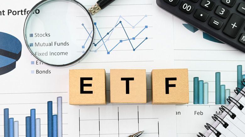 Wooden blocks spelling out the word "ETF"