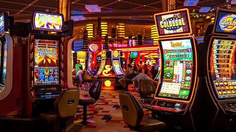 Gamblers seen on Las Vegas casino floor playing slot machines