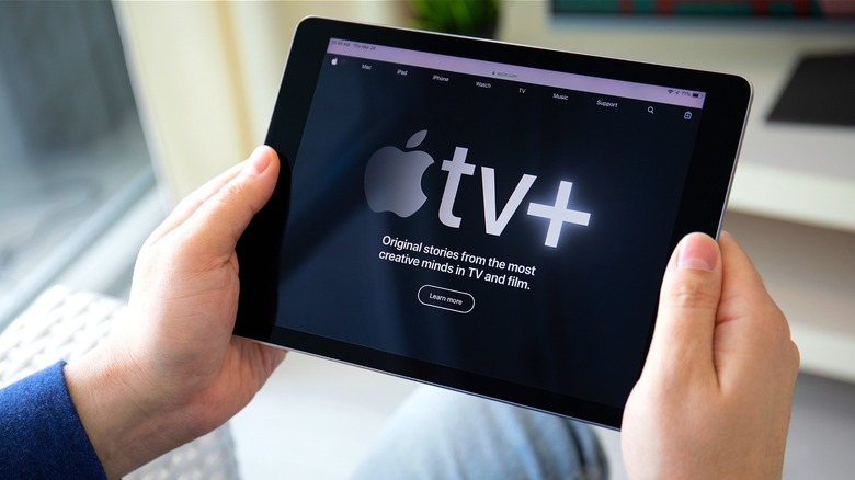 Person holding tablet, Apple TV+