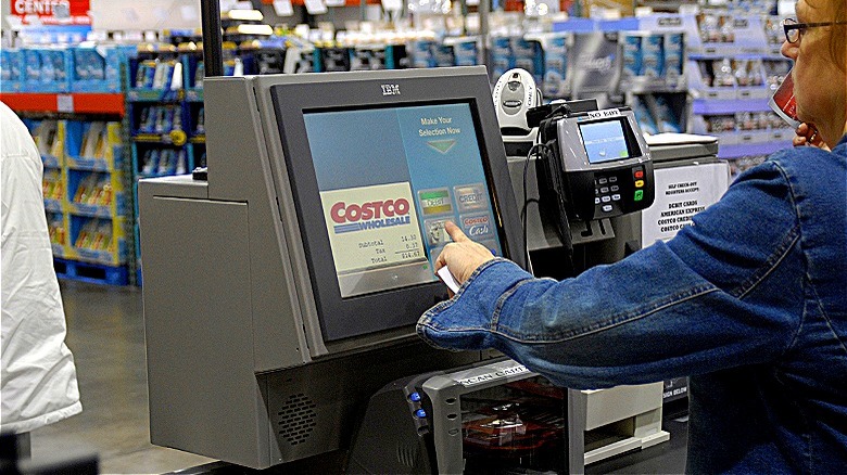Costco member at self-checkout