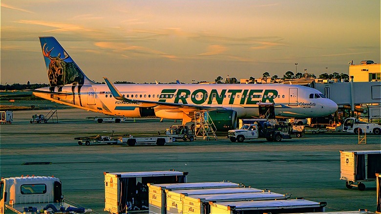 Frontier Airlines plane at sunset