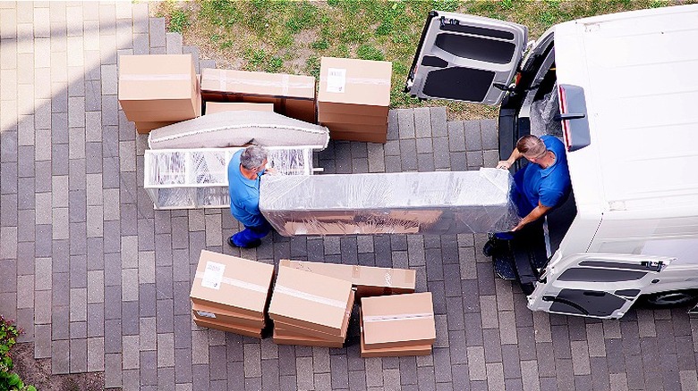 Professional movers load van